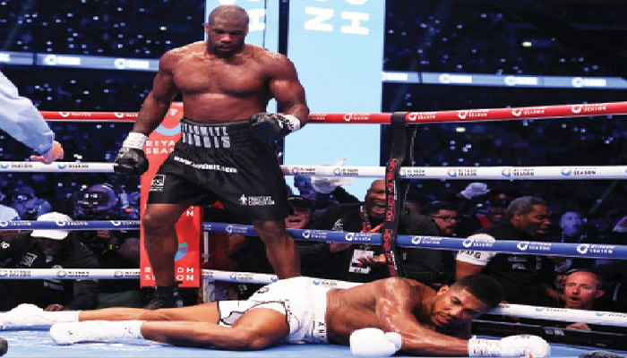 Sports: Joshua vows to keep boxing, hails Dubois.